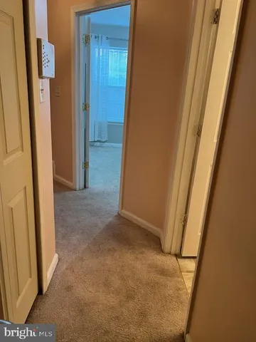 a view of hallway with a sink