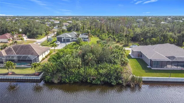a view of a lake with houses and city view