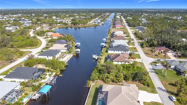 an aerial view of residential building and lake