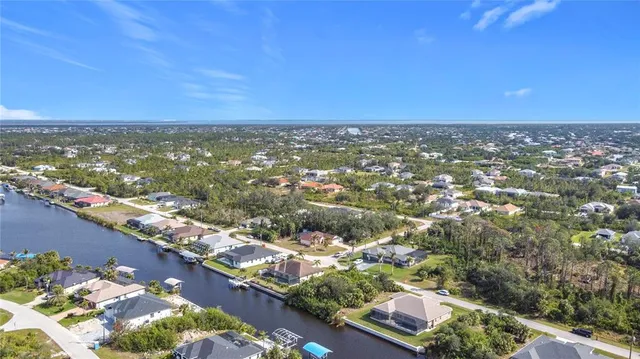 an aerial view of residential building and ocean view