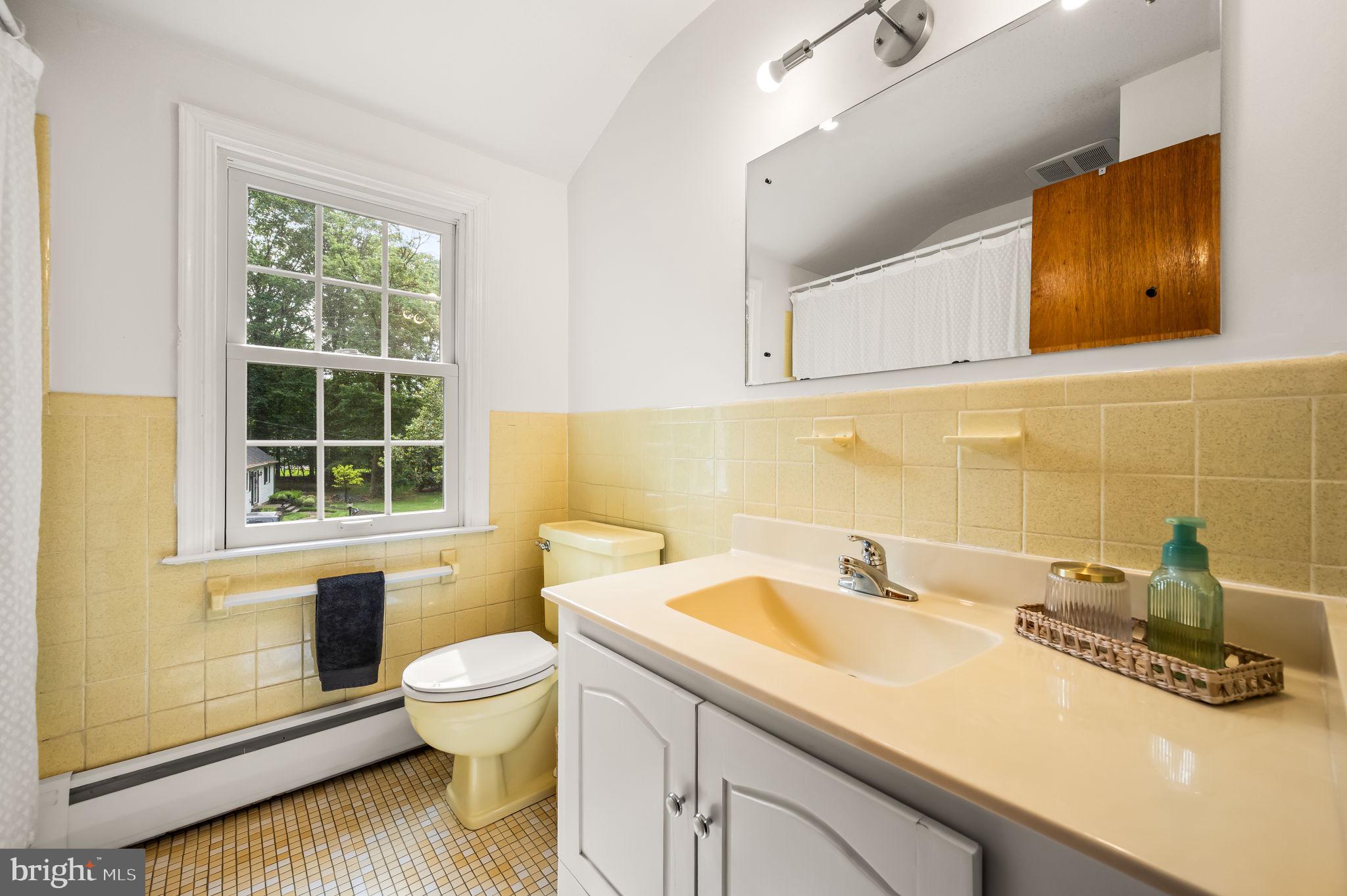 201 Morris Road Exton, PA 19341 - Photo 22 of 33 a bathroom with a sink a toilet and a window