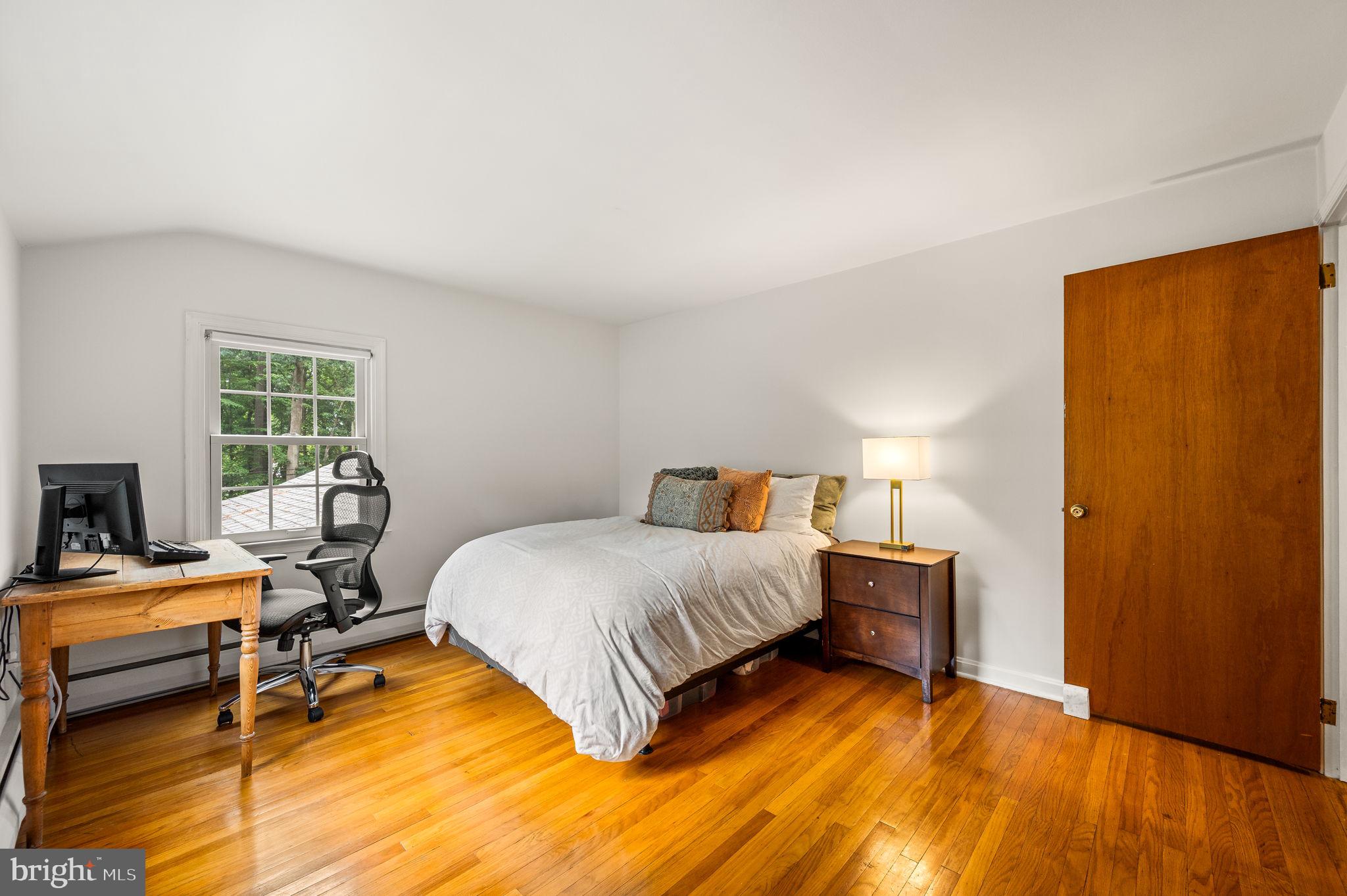 201 Morris Road Exton, PA 19341 - Photo 27 of 33 a bedroom with a bed and wooden floor
