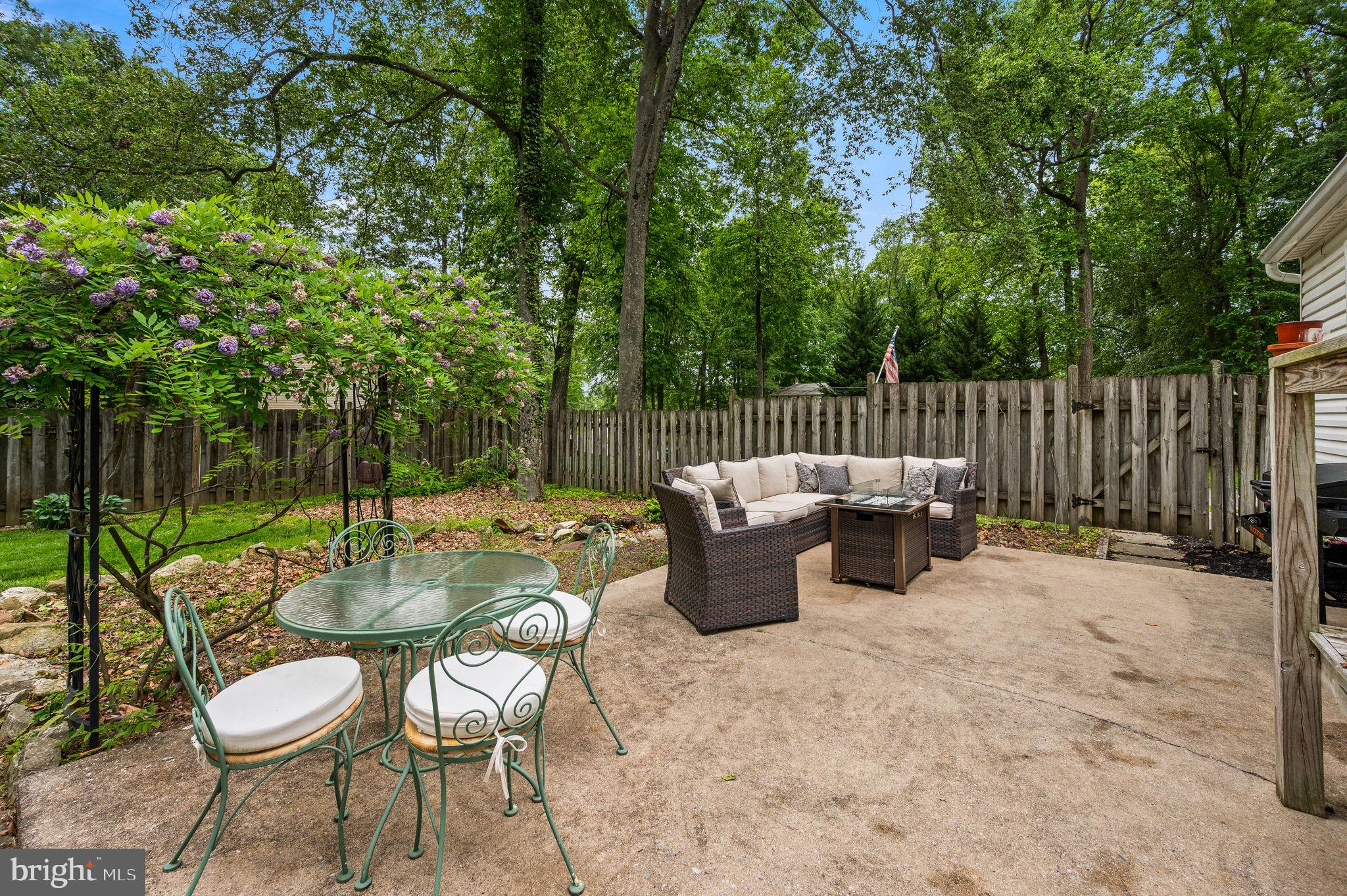 201 Morris Road Exton, PA 19341 - Photo 30 of 33 a view of a chair and fire pit in the backyard