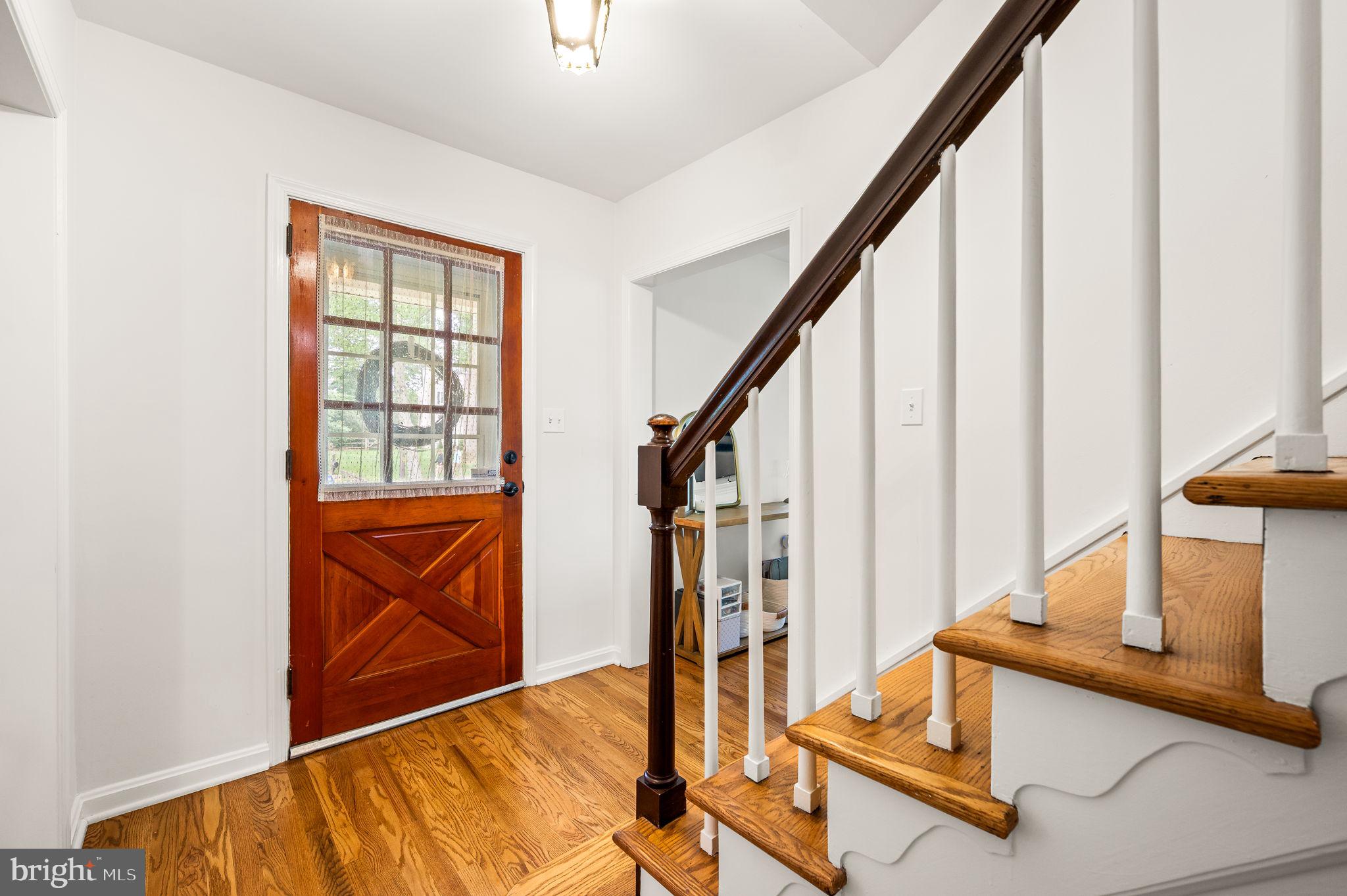201 Morris Road Exton, PA 19341 - Photo 6 of 33 a view of entryway with wooden floor and door