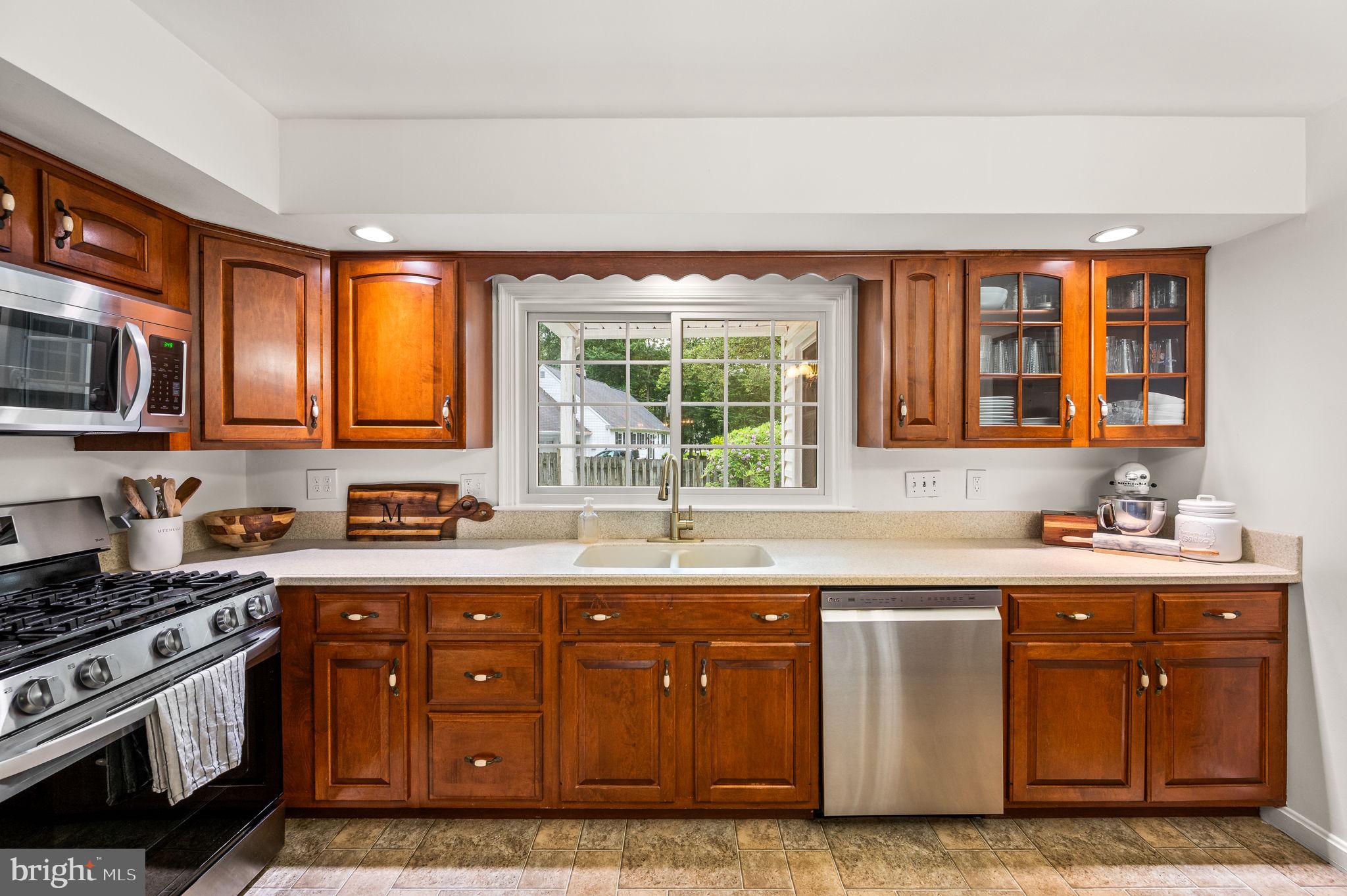 201 Morris Road Exton, PA 19341 - Photo 8 of 33 a kitchen with stainless steel appliances granite countertop a sink stove and microwave