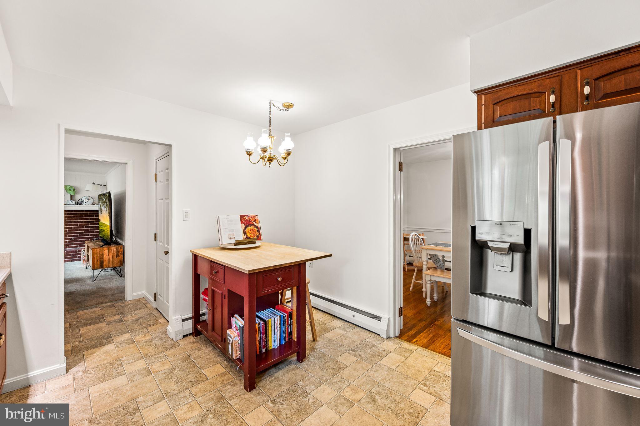 201 Morris Road Exton, PA 19341 - Photo 9 of 33 a kitchen with stainless steel appliances a refrigerator and a counter top space