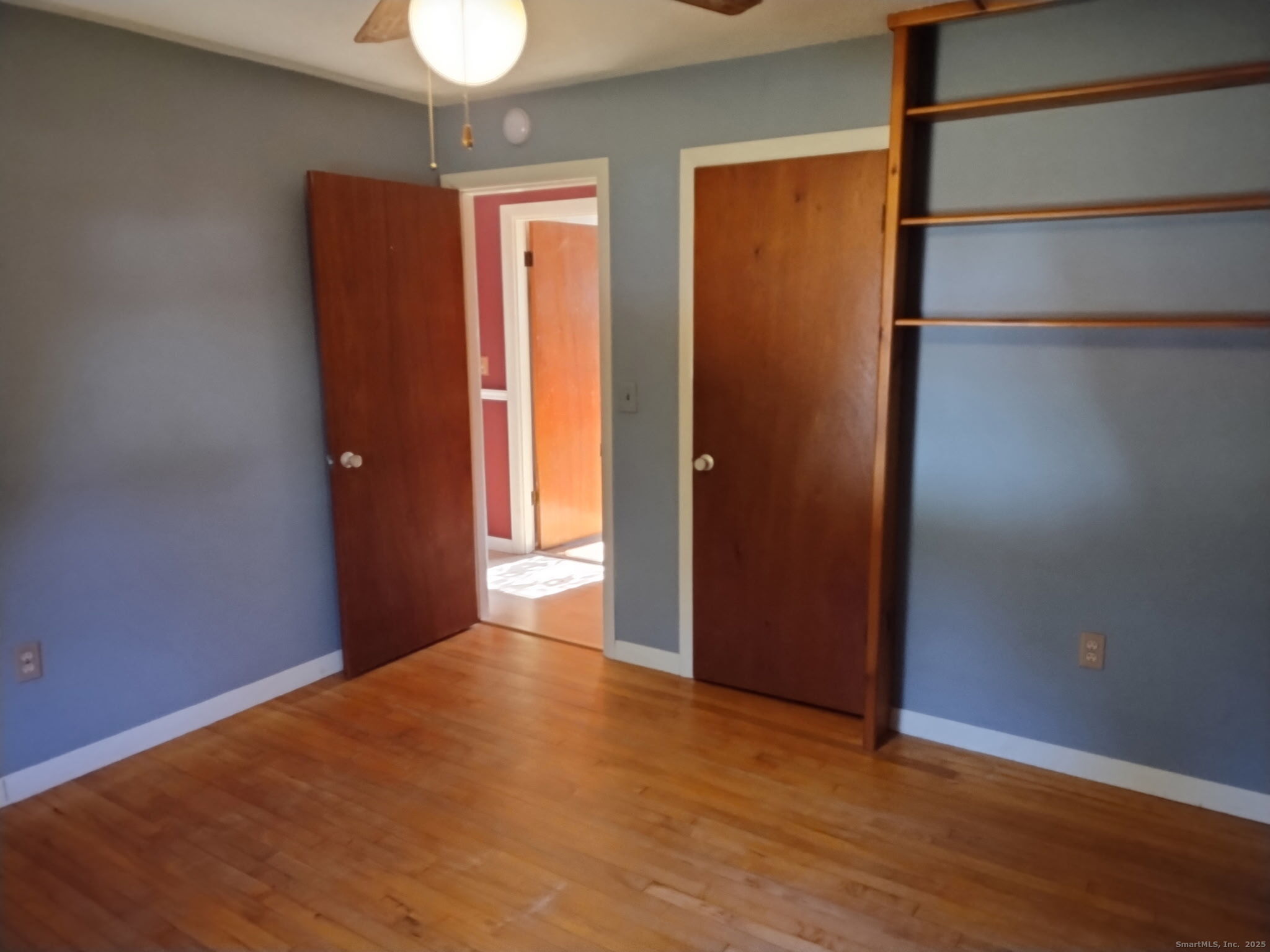 30 Lyon Road Woodstock, CT 06282 - Photo 12 of 19 an empty room with wooden floor and closet
