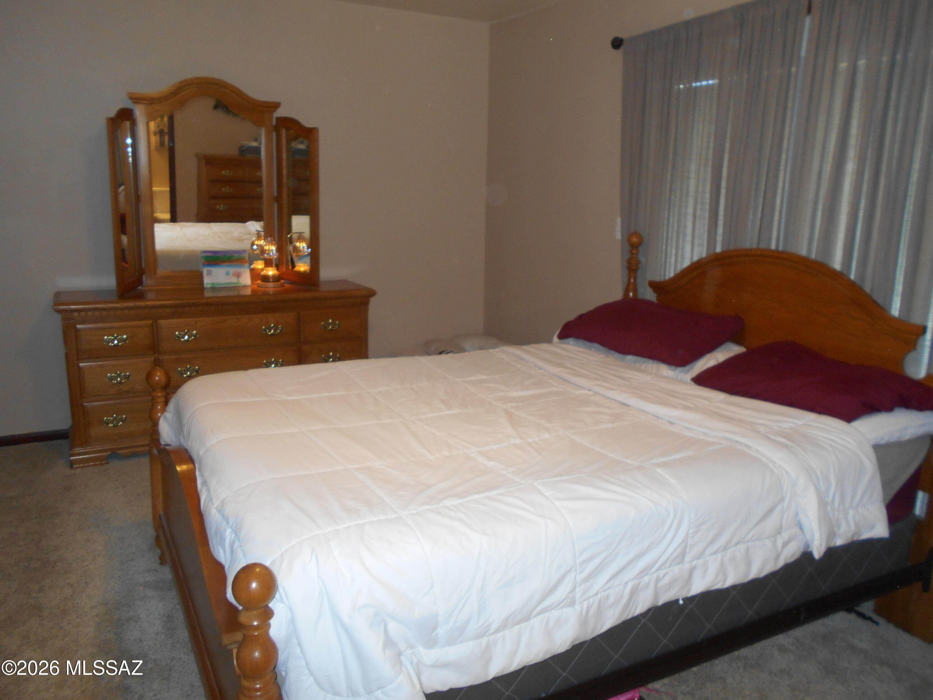 1201 East Old Stewart Road Willcox, AZ 85643 - Photo 12 of 49 a bedroom with a bed and dresser