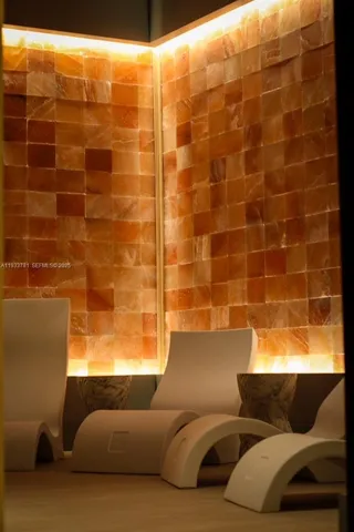 a bathroom with a couch and a window