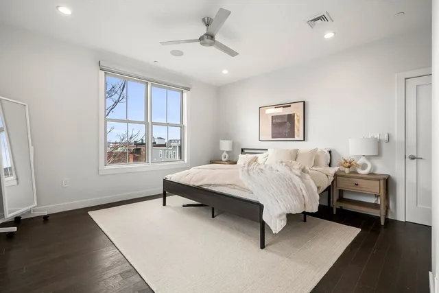 a bed room with a bed and a window