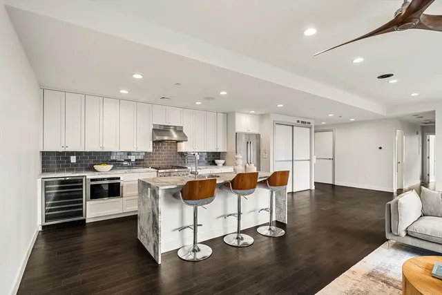 a kitchen with a table and chairs in it