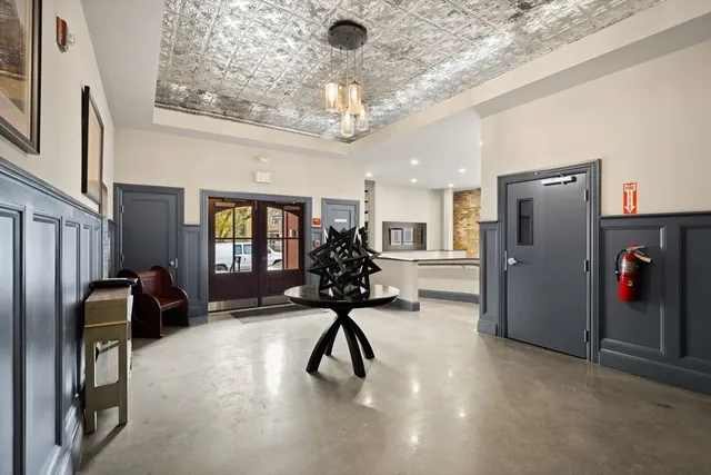 a view of a livingroom with furniture gym equipment