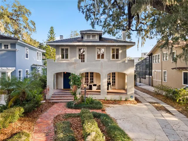a front view of a house with garden