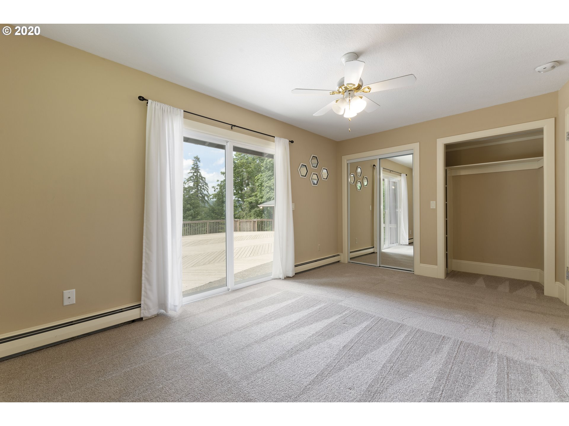 16245 Northwest McNamee Road Portland, OR 97231 - Photo 19 of 32 a view of a livingroom with a ceiling fan and window