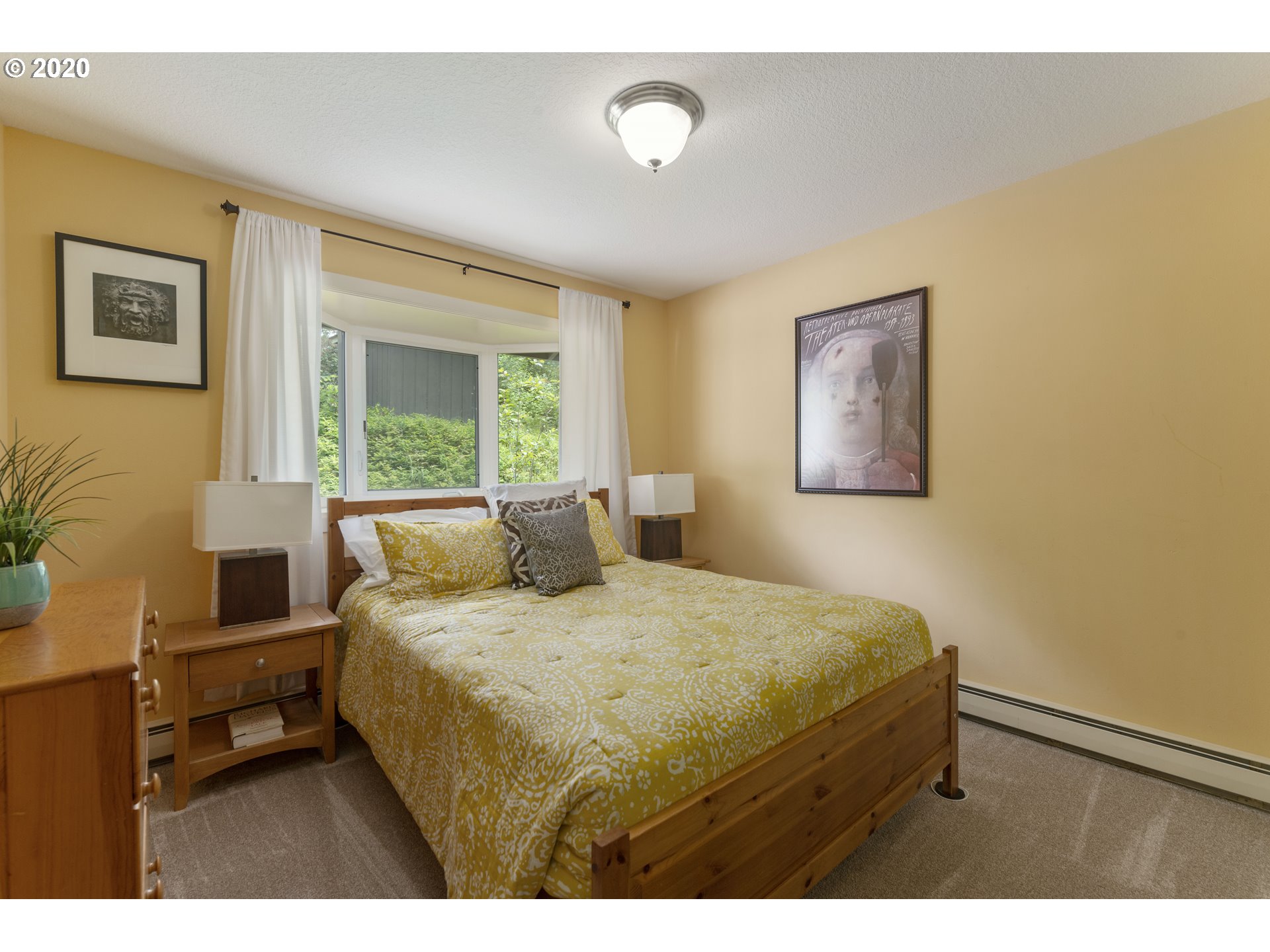 16245 Northwest McNamee Road Portland, OR 97231 - Photo 20 of 32 a bedroom with a bed and a couch