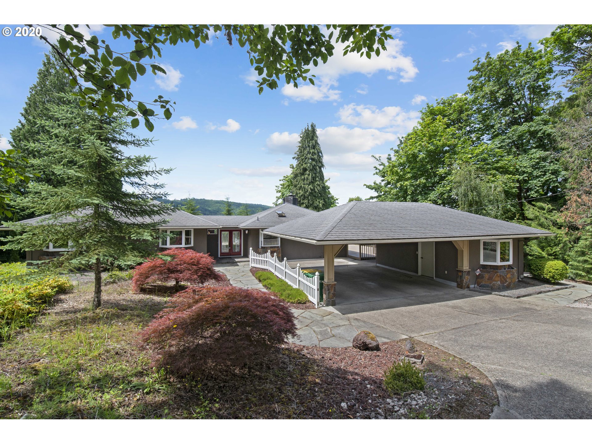 16245 Northwest McNamee Road Portland, OR 97231 - Photo 2 of 32 a view of a house with a yard and a garden