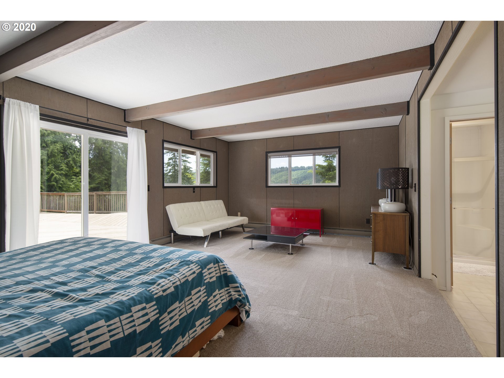 16245 Northwest McNamee Road Portland, OR 97231 - Photo 24 of 32 a bedroom with a bed and a large window