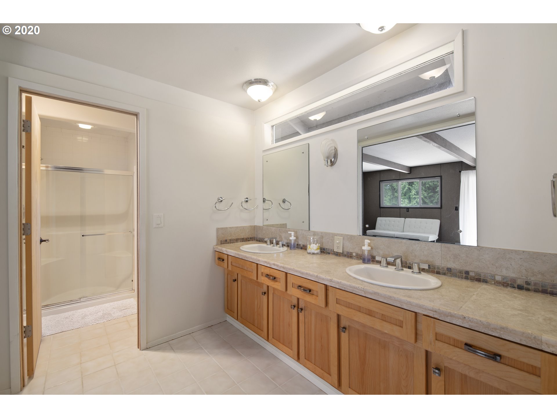 16245 Northwest McNamee Road Portland, OR 97231 - Photo 27 of 32 a bathroom with a granite countertop sink mirror and double