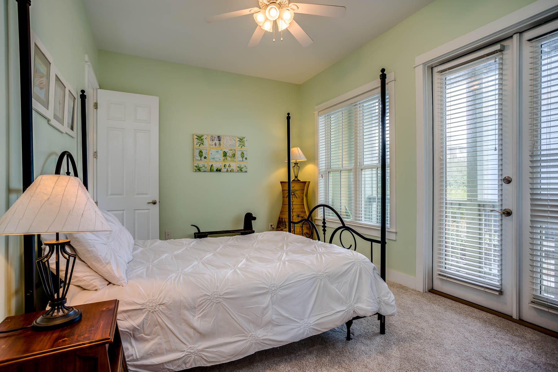 96 Chelsea Loop Road Santa Rosa Beach, FL 32459 - Photo 16 of 26 a bedroom with a bed and a chandelier