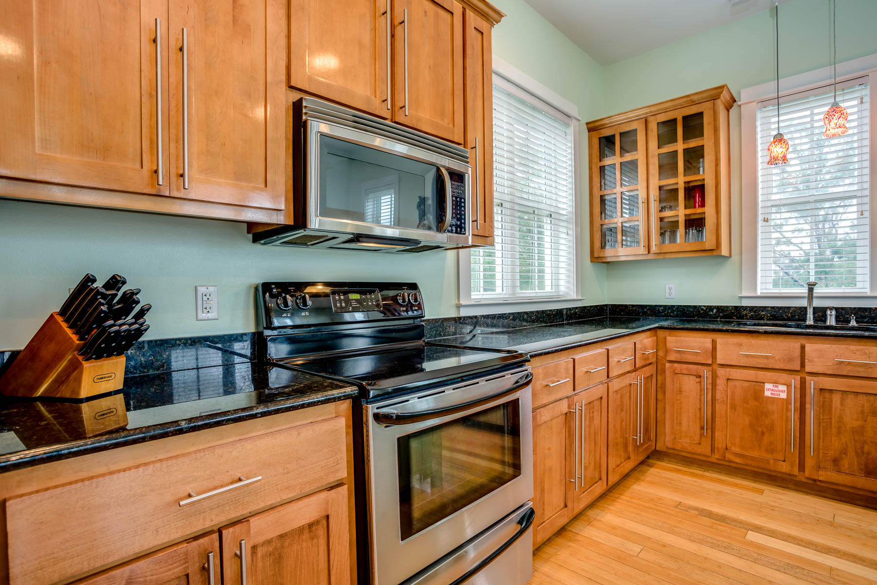 96 Chelsea Loop Road Santa Rosa Beach, FL 32459 - Photo 10 of 26 a kitchen with stainless steel appliances granite countertop a stove a sink and a microwave