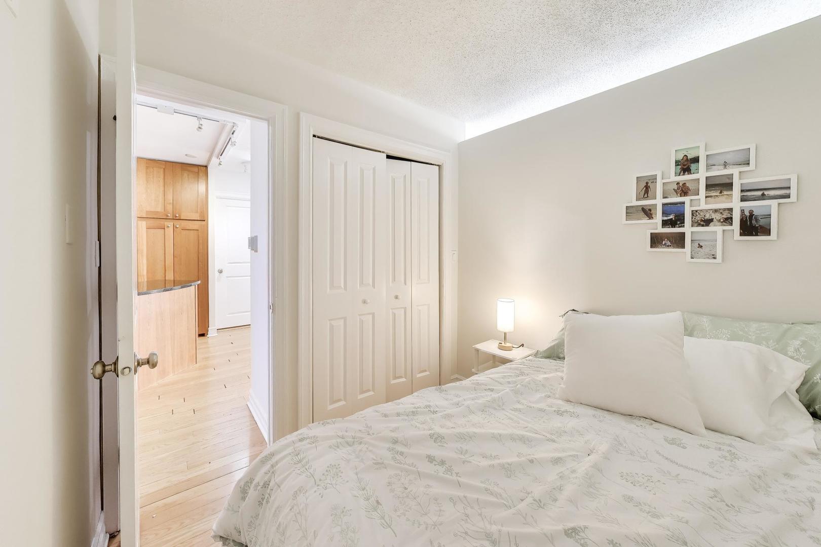 2930 North Sheridan Road, Unit 702 Chicago, IL 60657 - Photo 11 of 25 a large white bed in a white room