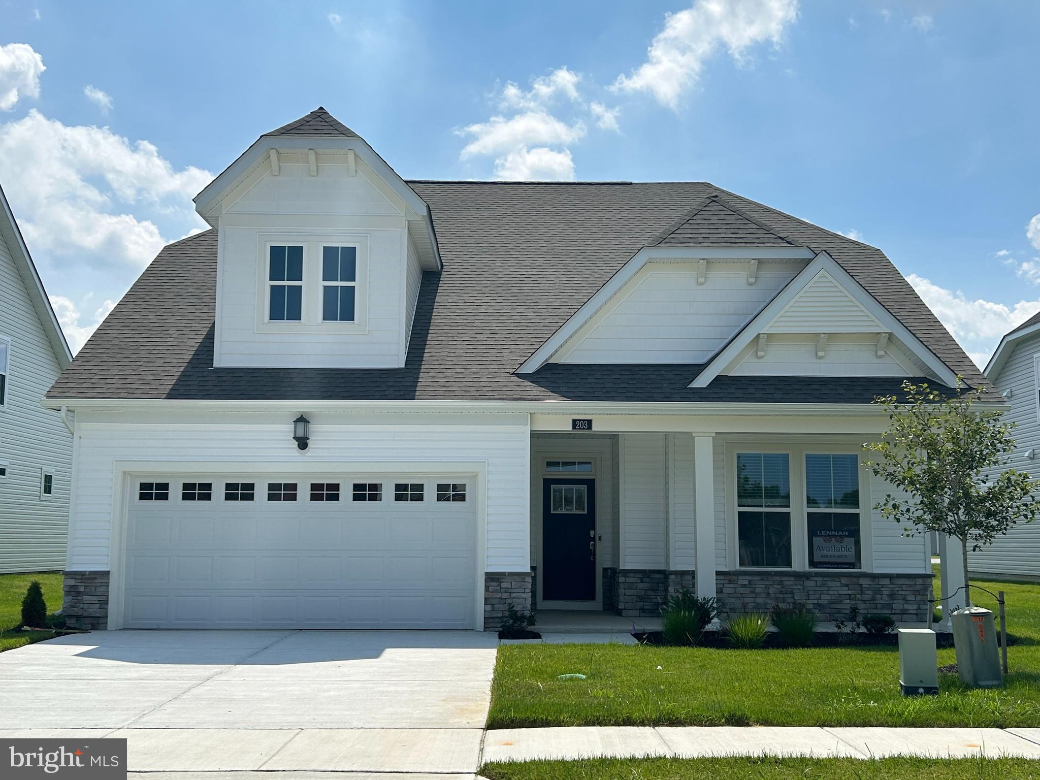 203 Mariners Circle Milton, DE 19968 - Photo 1 of 32 a front view of a house with a yard