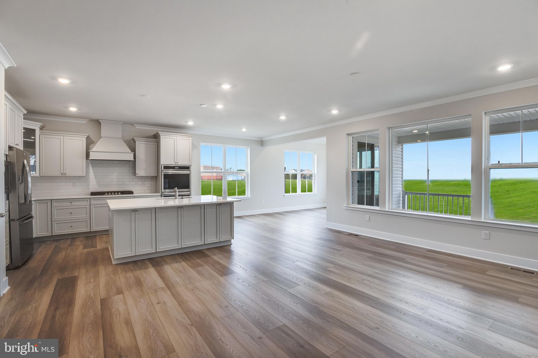 203 Mariners Circle Milton, DE 19968 - Photo 15 of 32 a view of kitchen with wooden floor and electronic appliances