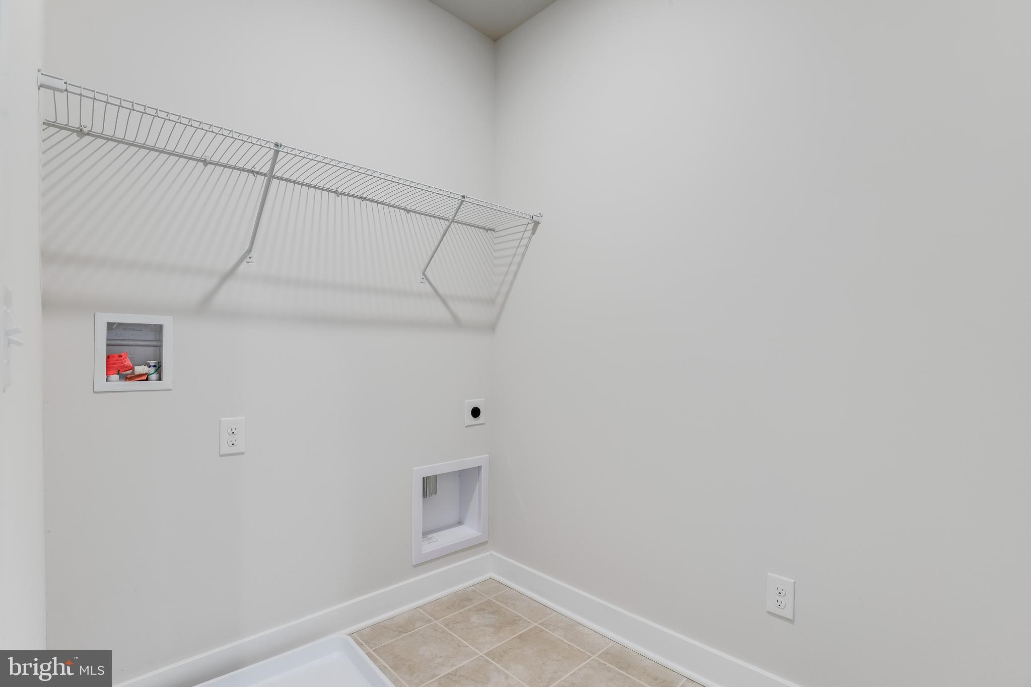 203 Mariners Circle Milton, DE 19968 - Photo 8 of 32 a view of a room with racks on the wall