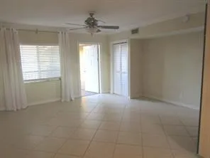 a kitchen with a granite countertop sink and a window