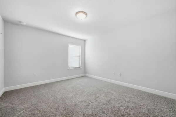 an empty room with a empty space and window