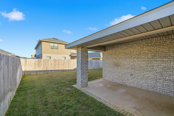 a view of a back yard of the house