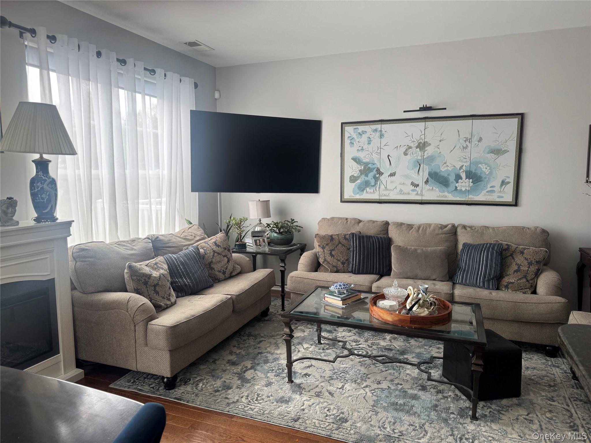 21 High Ridge Lane, Unit 21 Middletown, NY 10940 - Photo 12 of 33 a living room with furniture and a flat screen tv