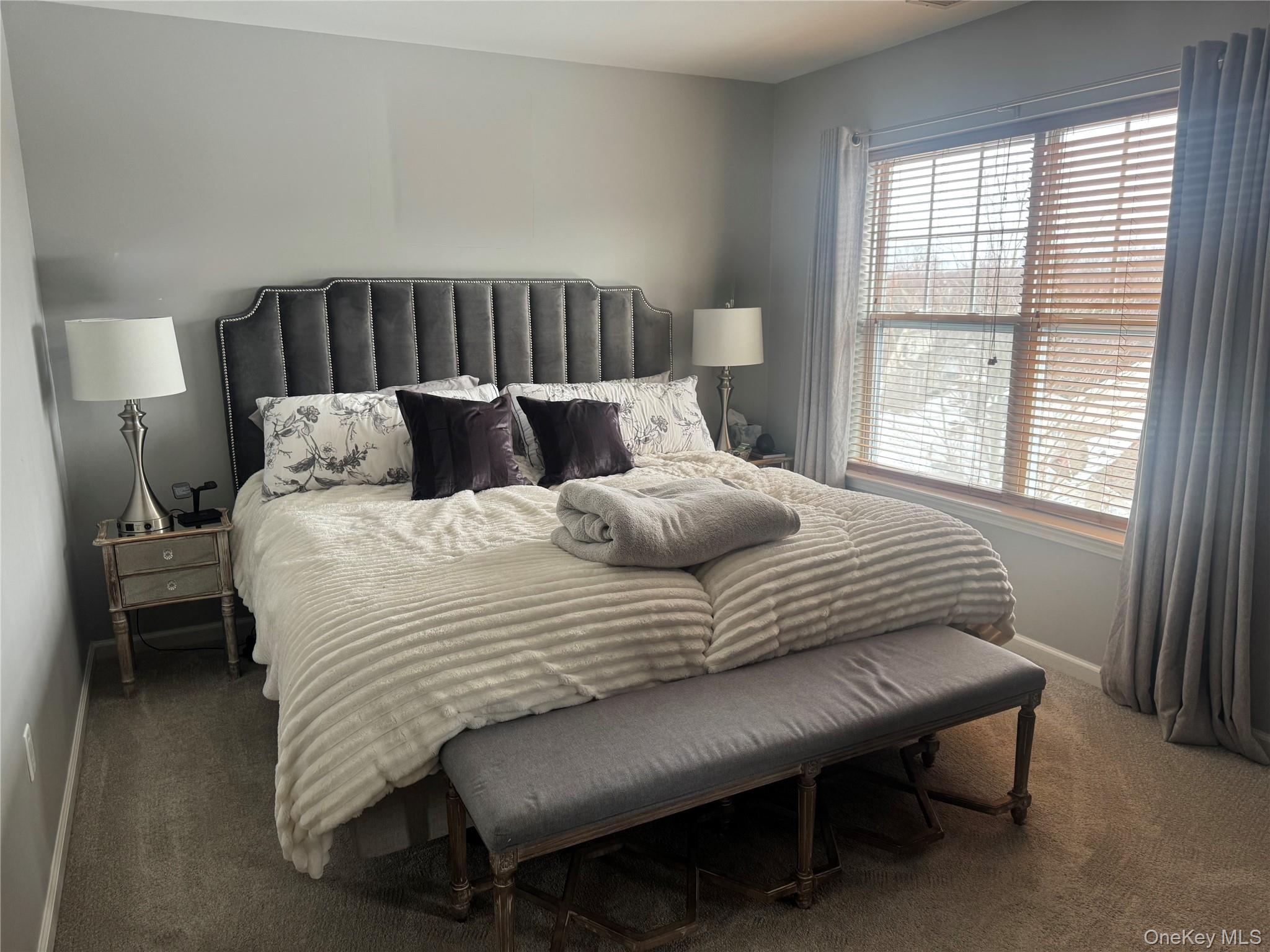 21 High Ridge Lane, Unit 21 Middletown, NY 10940 - Photo 15 of 33 a large white bed sitting in a bedroom next to a window