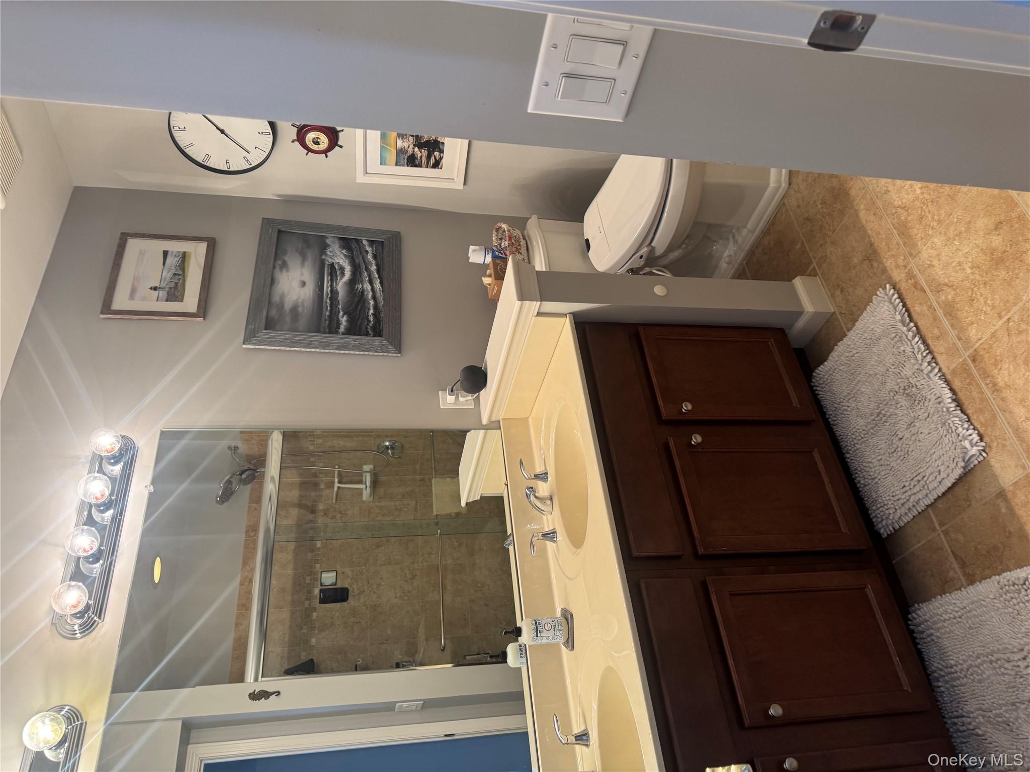 21 High Ridge Lane, Unit 21 Middletown, NY 10940 - Photo 16 of 33 a bathroom with a double vanity sink toilet and a mirror