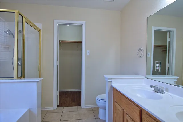 a bathroom with a sink toilet and vanity