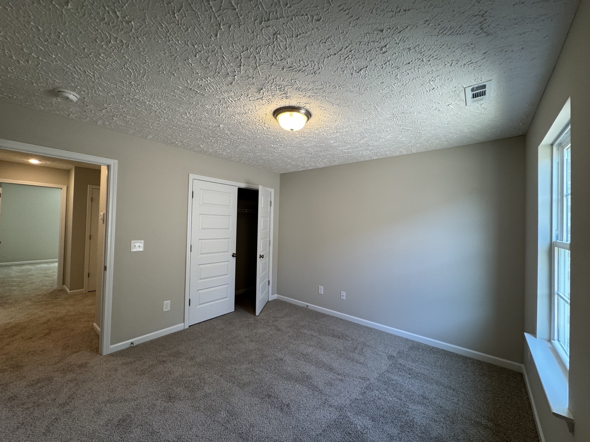 57 Laurel View Street Manchester, TN 37355 - Photo 18 of 23 an empty room with closet and windows