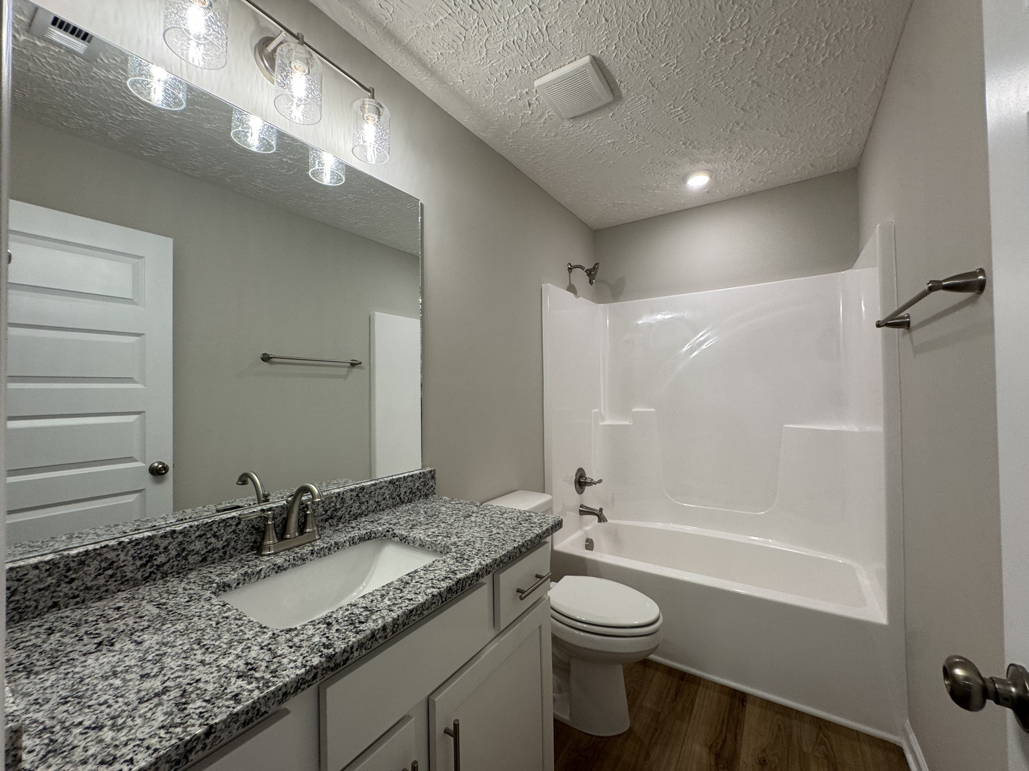 57 Laurel View Street Manchester, TN 37355 - Photo 20 of 23 a bathroom with a granite countertop sink toilet and shower