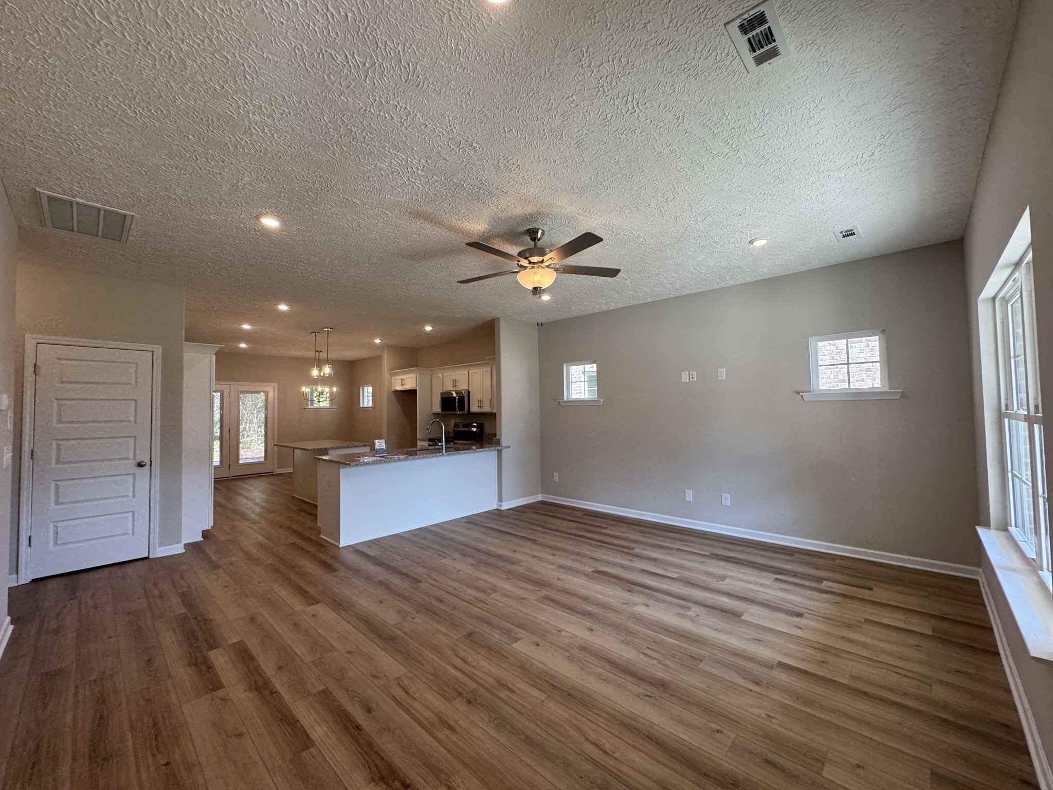 57 Laurel View Street Manchester, TN 37355 - Photo 4 of 23 a view of a livingroom with a ceiling fan window and wooden floor