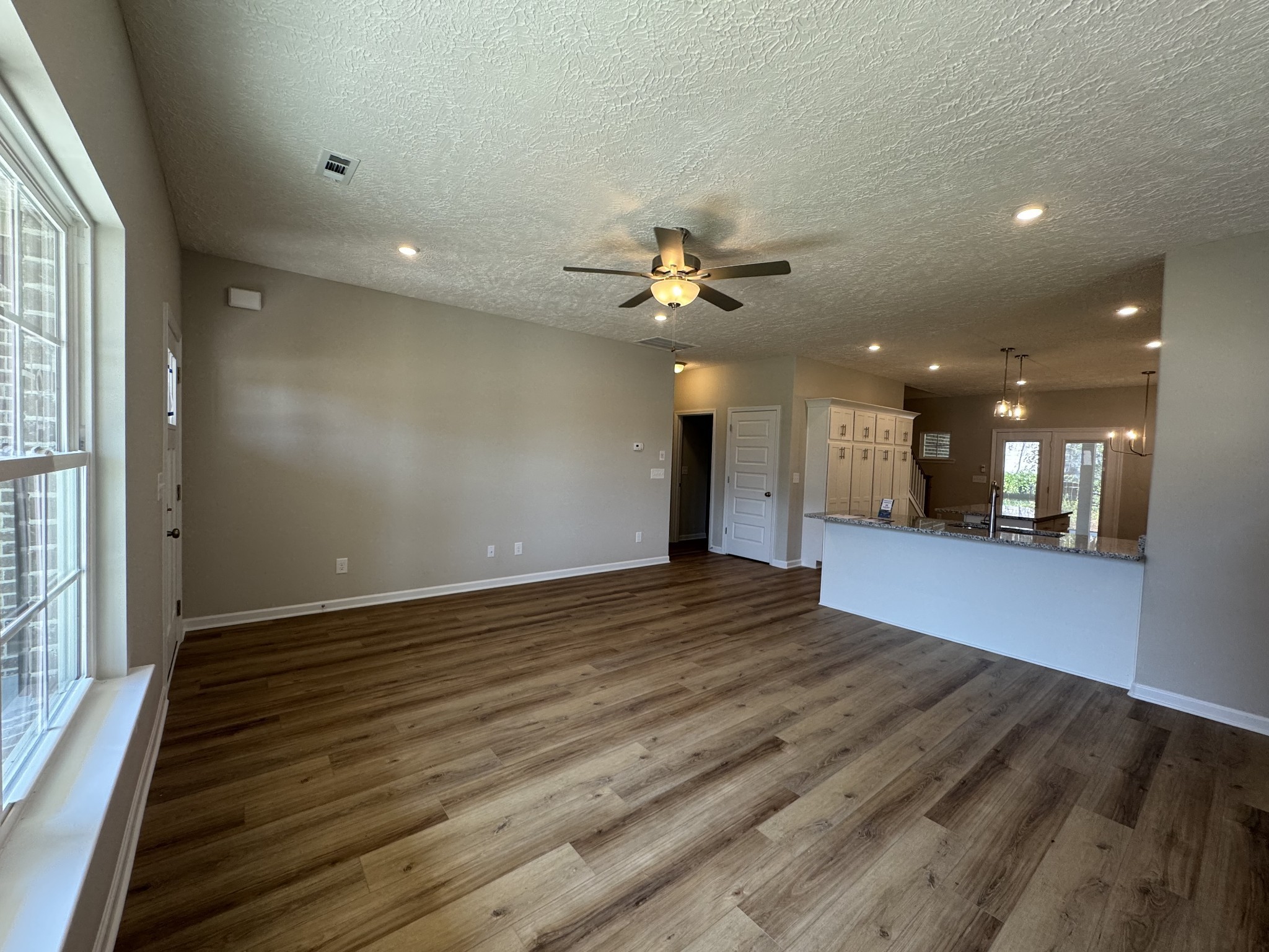 57 Laurel View Street Manchester, TN 37355 - Photo 5 of 23 a view of an empty room with wooden floor and a window
