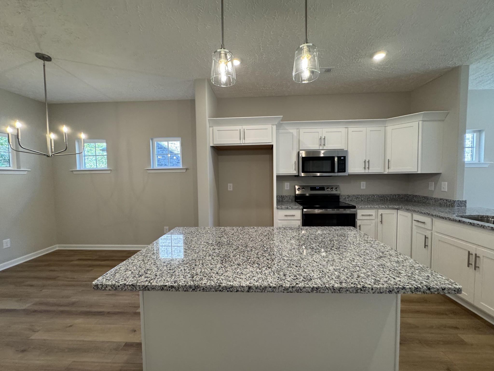 57 Laurel View Street Manchester, TN 37355 - Photo 7 of 23 a kitchen with granite countertop a sink a counter top space cabinets and stainless steel appliances