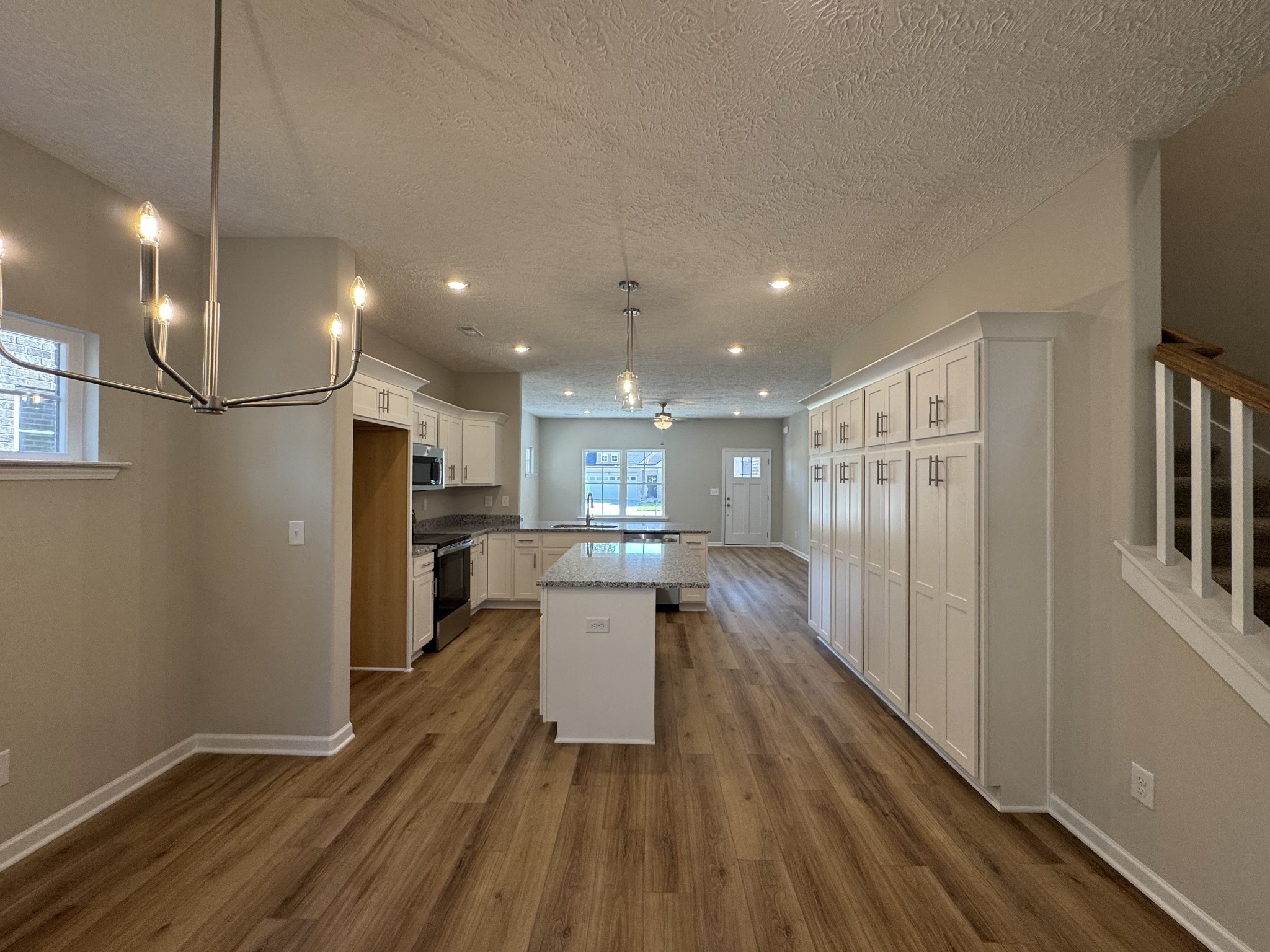 57 Laurel View Street Manchester, TN 37355 - Photo 8 of 23 a kitchen with stainless steel appliances granite countertop a refrigerator a sink dishwasher a stove and a refrigerator with wooden floor