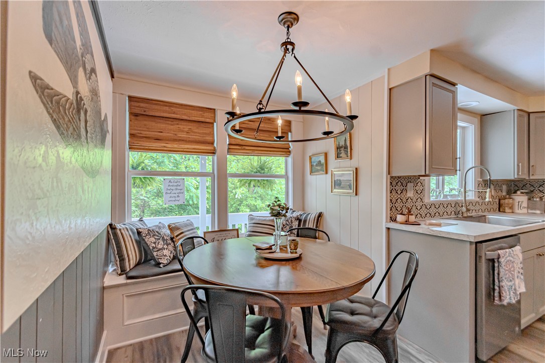 238 East Schaaf Road Independence, OH 44131 - Photo 9 of 39 Dining room with light wood finished floors and a chandelier