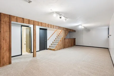 a view of an empty room with stairs