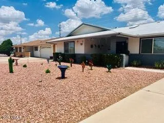 a view of a house with a yard covered in snow