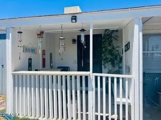 a view of a balcony with wooden floor