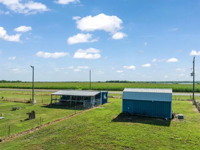 a view of a garden with lawn chairs