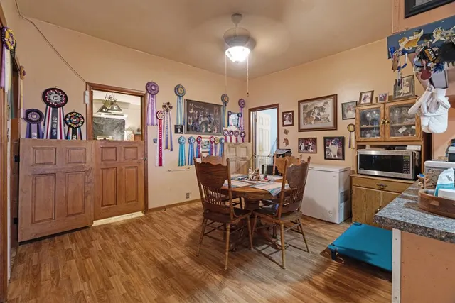 a view of a dining room with furniture and wooden floor