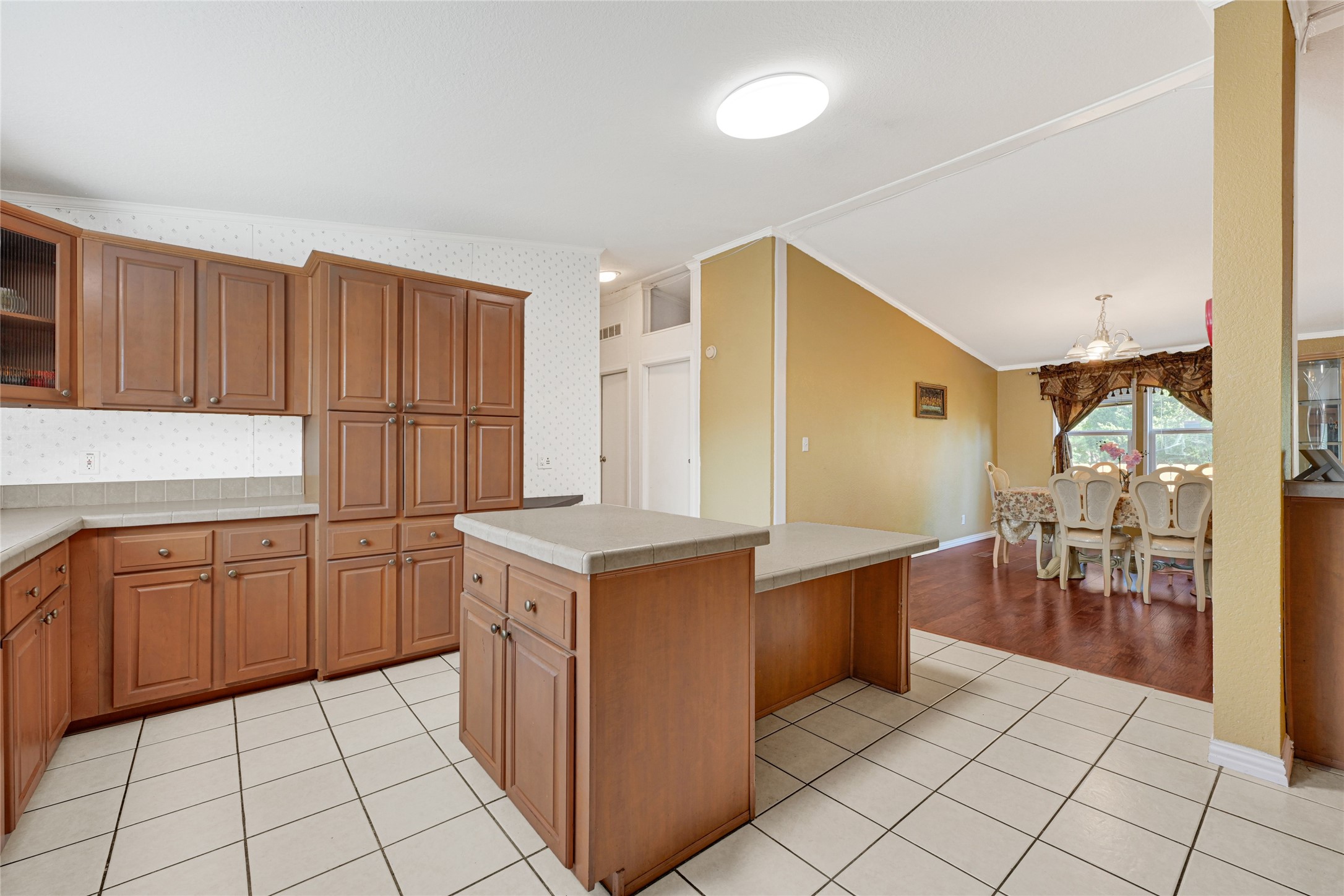 3233 Clarksville Street La Porte, TX 77571 - Photo 14 of 21 a kitchen with cabinets and chairs