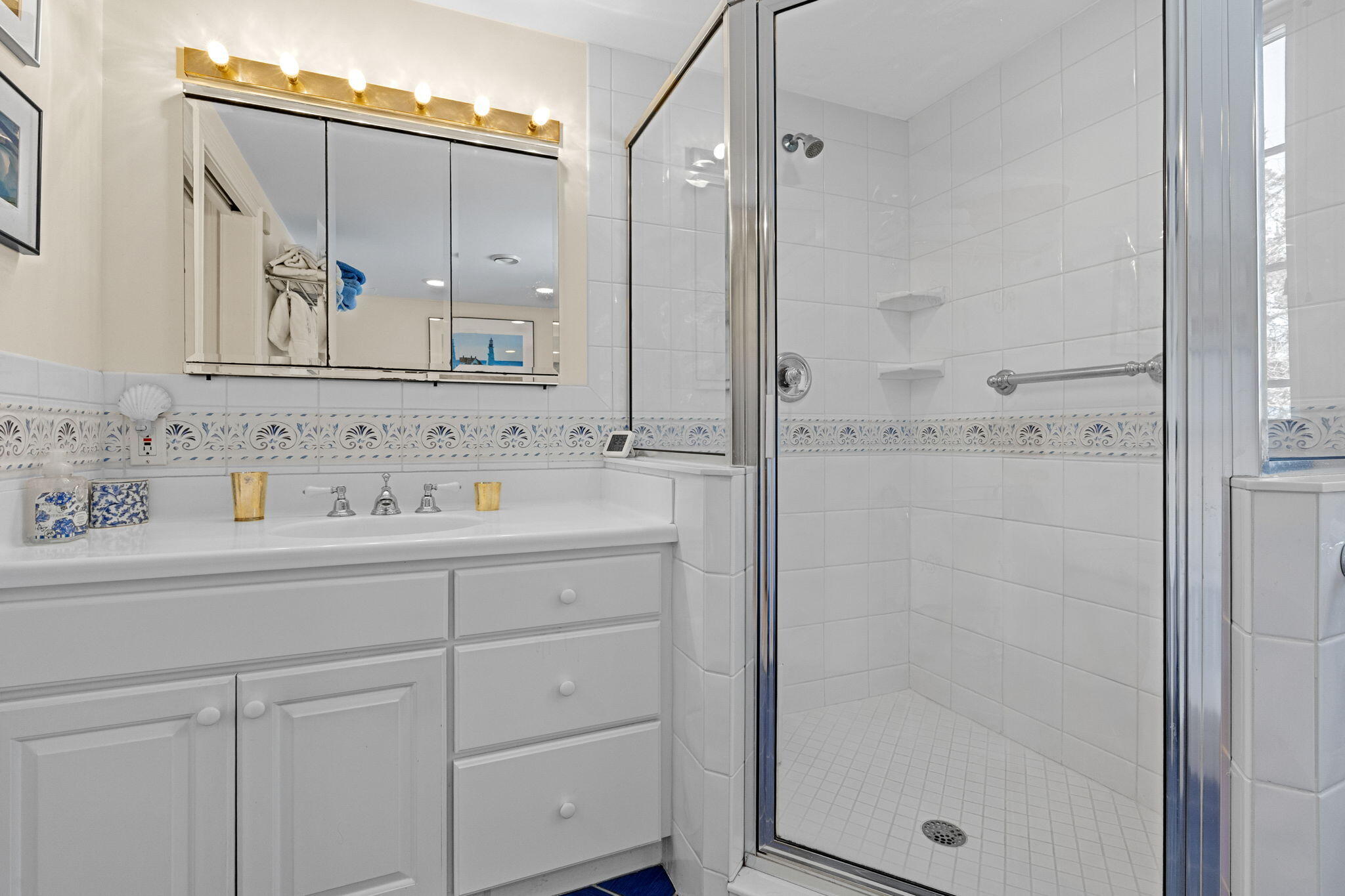 16 Old Salt Works Road Chatham, MA 02633 - Photo 38 of 69 a bathroom with a shower sink and mirror