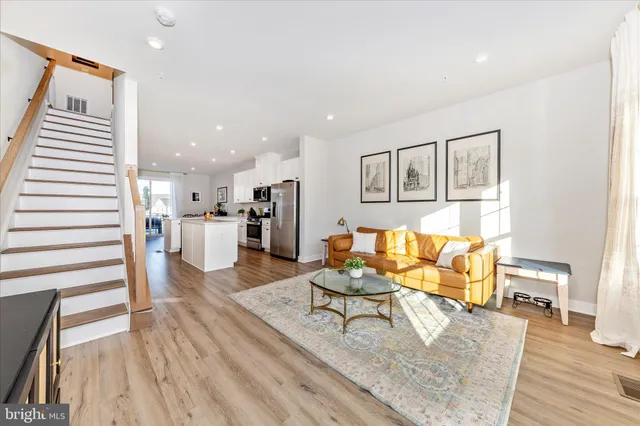 a kitchen with appliances a sink and cabinets